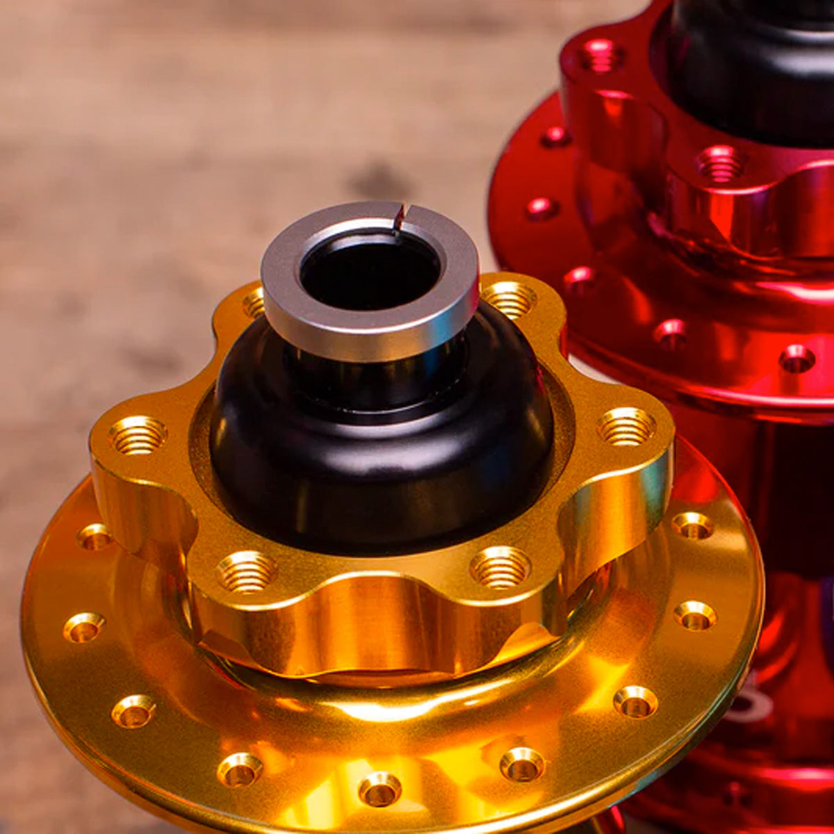 Chris King 6 Bolt Boost Front Hub in Gold and Red